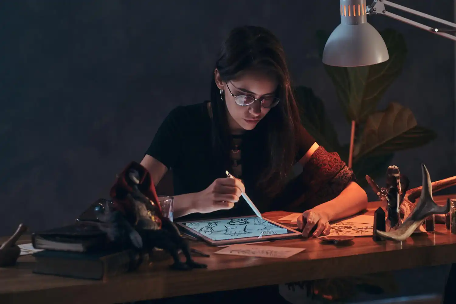 3d artist working on digital design and sketching concepts at desk