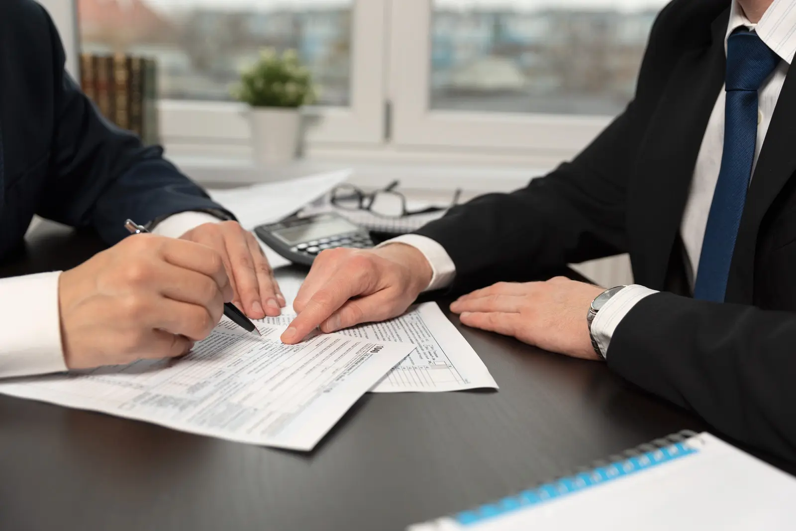 men reviewing documents